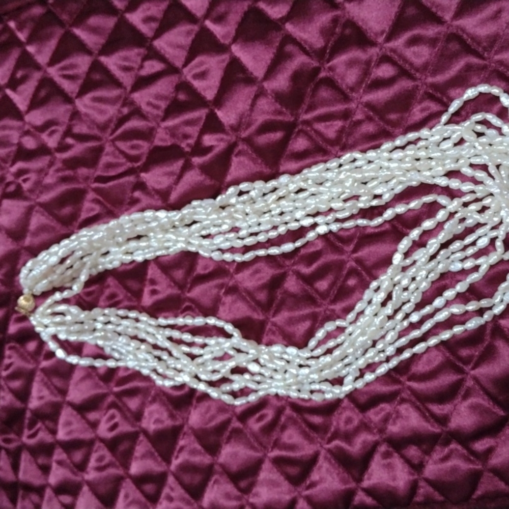 Beaded seashell pearl colored 9 strand necklace